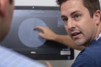 Interventional radiologist in consultation with patient